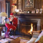 Santa reads in front of the fire Santa reads in front of the fire