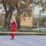 Santa has a quick game of tennis Santa has a quick game of tennis
